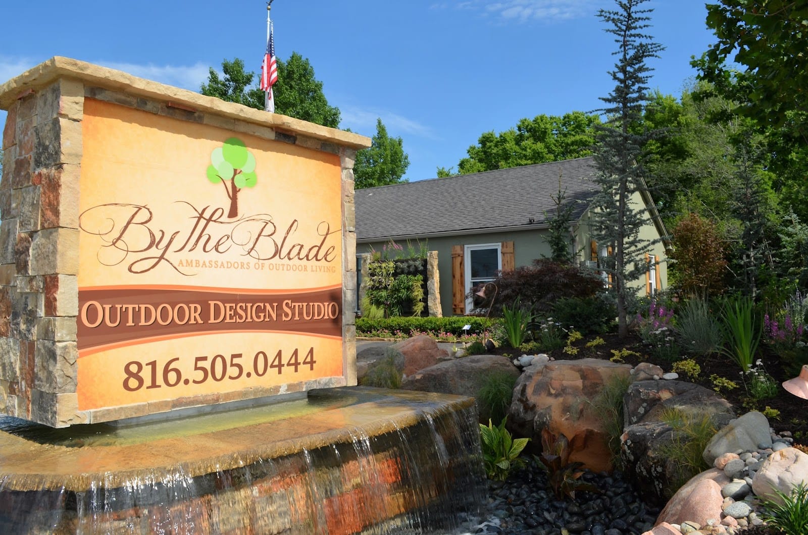 The By The Blade Outdoor Design Studio monument sign at the Parkville office